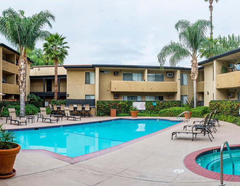 Exterior architectural image of the pool and common areas of an apartment complex in Canoga Park, California