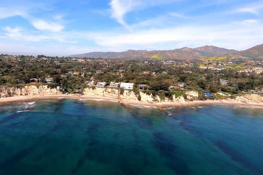 HD Aerial Video Frame of the Ocean Front Homes in Malibu, California with the California Poppies Visible in the Mountains