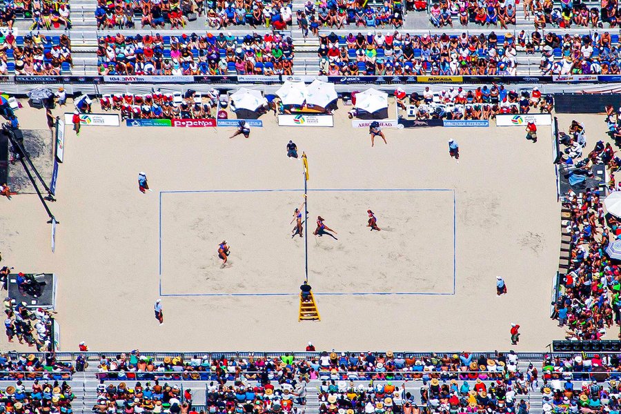 Sports photo of two players at the net during the 2014 ASICS World Series of Volleyball