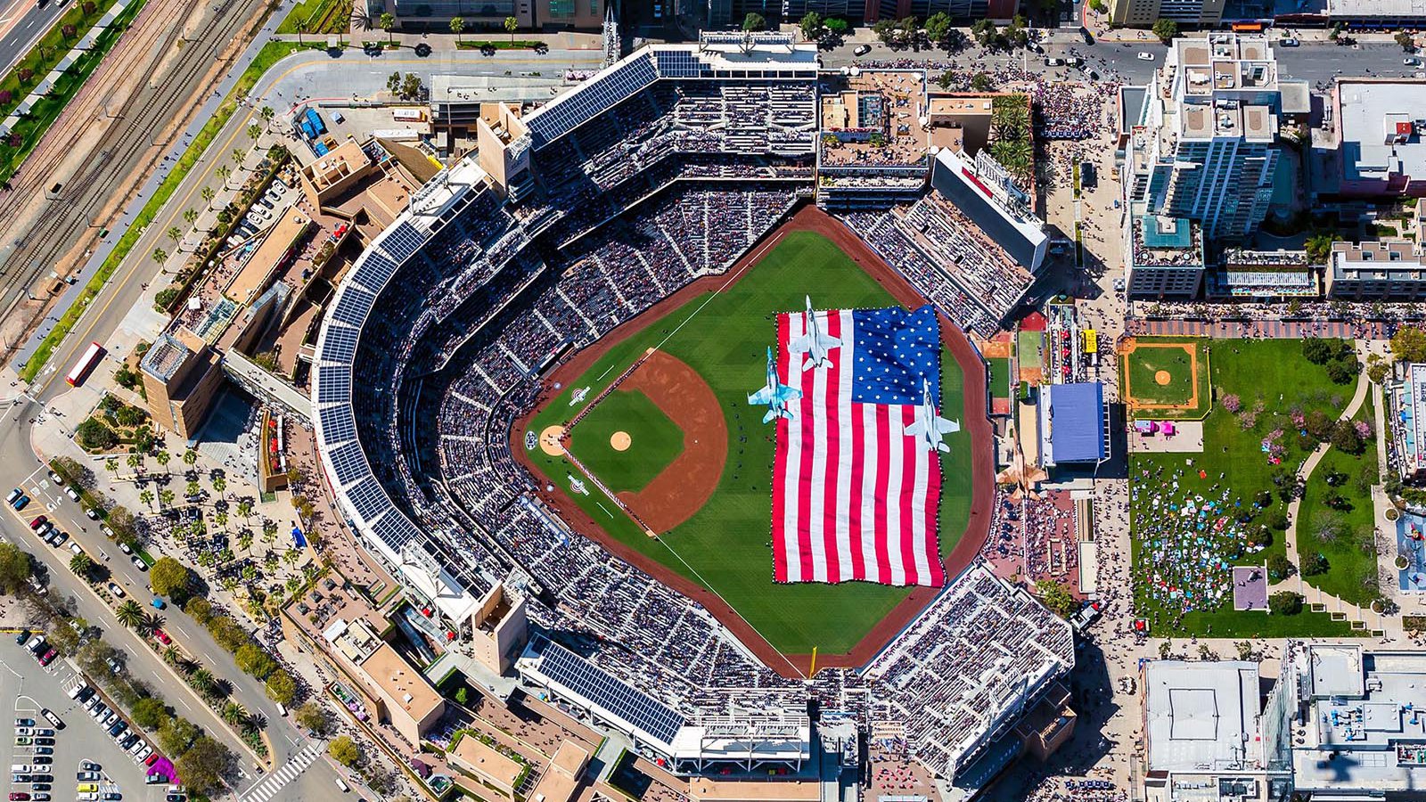 Sports photograph of 4 F-18s flying over the 2019 San Diego Padres Opening Day at Petco Park