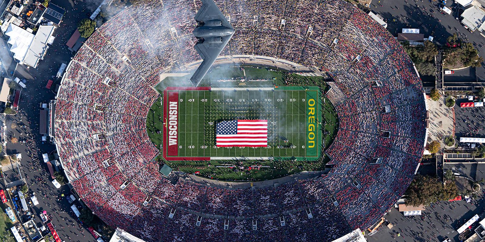 A B-2 Stealth Bomber Flies over the 106th Rose Bowl Game | West Coast