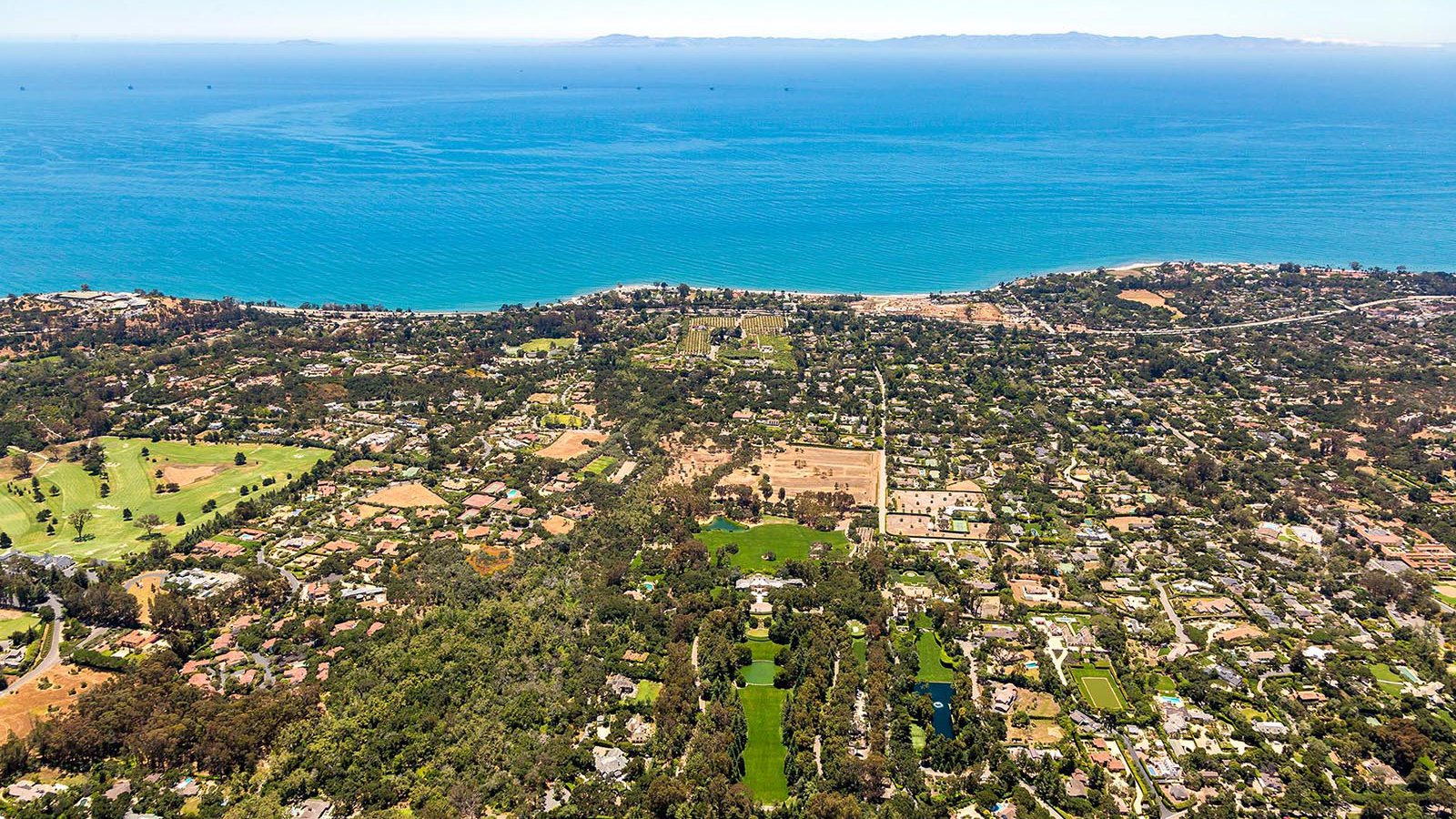 Residential celebrity real estate photo of Oprah Winfrey's The Promised Land home in Montecito, California with Anacapa and Santa Cruz Islands in the background
