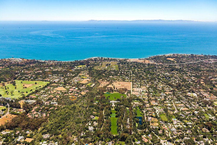 Residential celebrity real estate photo of Oprah Winfrey's The Promised Land home in Montecito, California with Anacapa and Santa Cruz Islands in the background