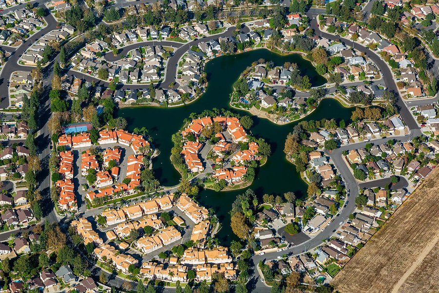 Residential community real estate image of the Portofino at Creekside housing community in Ontario, California