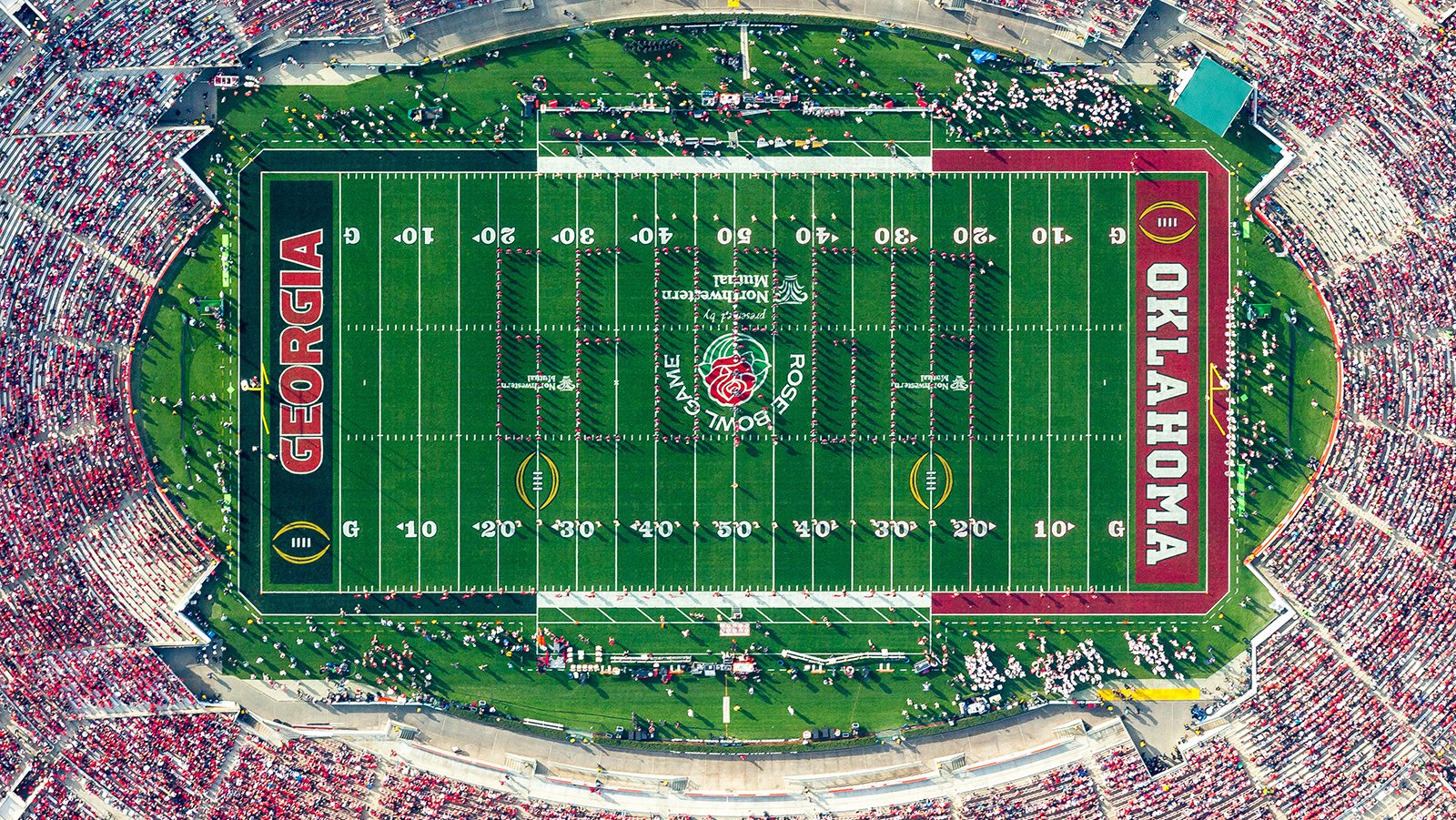 The University of Georgia Bulldogs marching band is proudly spelling out 'GEORGIA' in the iconic Rose Bowl Stadium, as thousands of dedicated and passionate fans cheer them on during the 2018 Rose Bowl Game in Pasadena, California.
