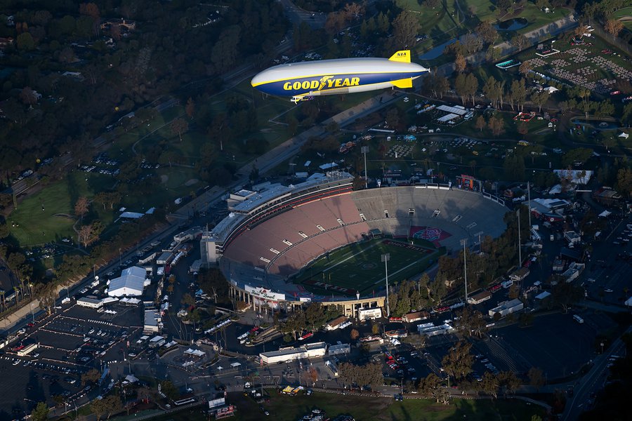 Blog photo of the Goodyear Blimp flying over the Rose Bowl Stadium in the early morning on New Years Day 2022