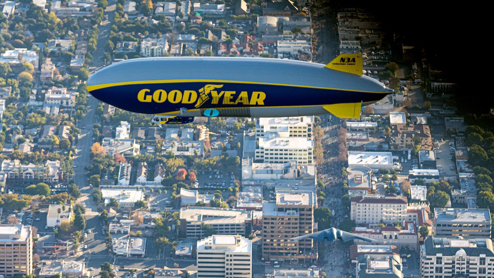 Blog photo of the B-2 Stealth Bomber flying under the Goodyear Blimp in Pasadena, California