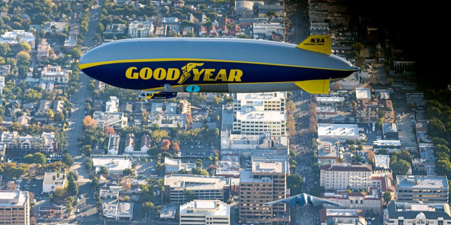 Blog photo of the B-2 Stealth Bomber flying under the Goodyear Blimp in Pasadena, California