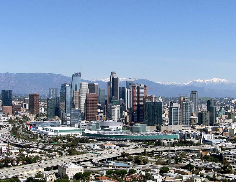 HD Aerial Helicopter Still Image of Downtown Los Angeles, California with Snow in the Mountains