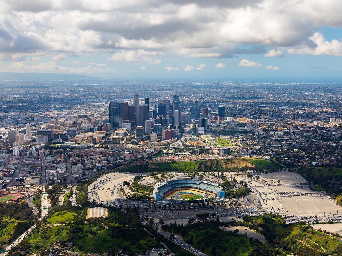 Aerial cityscape of Dodger Stadium overlooking Downtown Los Angeles, one of LA's most iconic sports stadiums