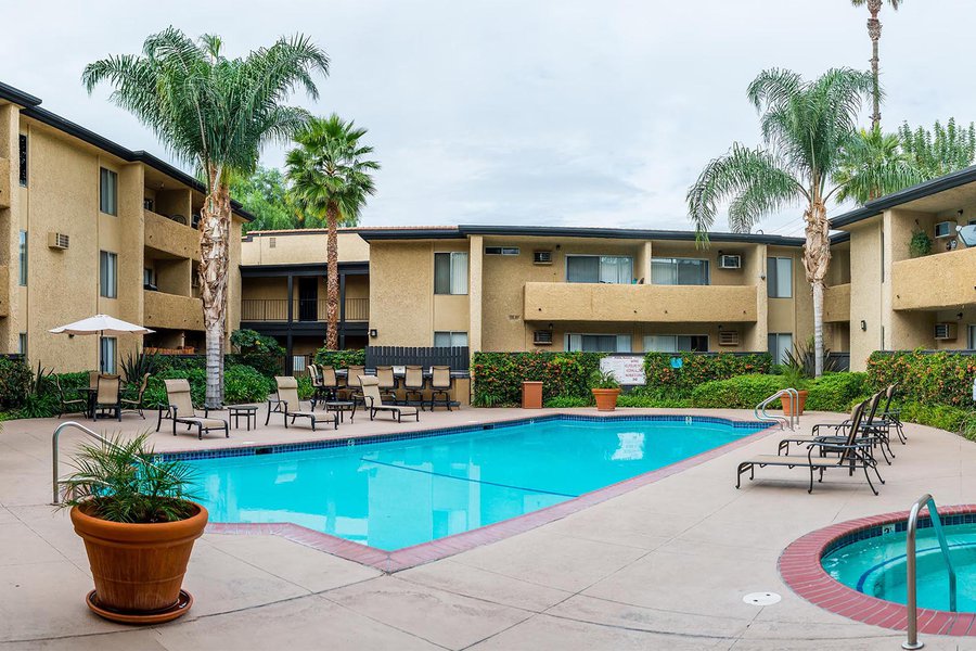 Exterior architectural image of the pool and common areas of an apartment complex in Canoga Park, California