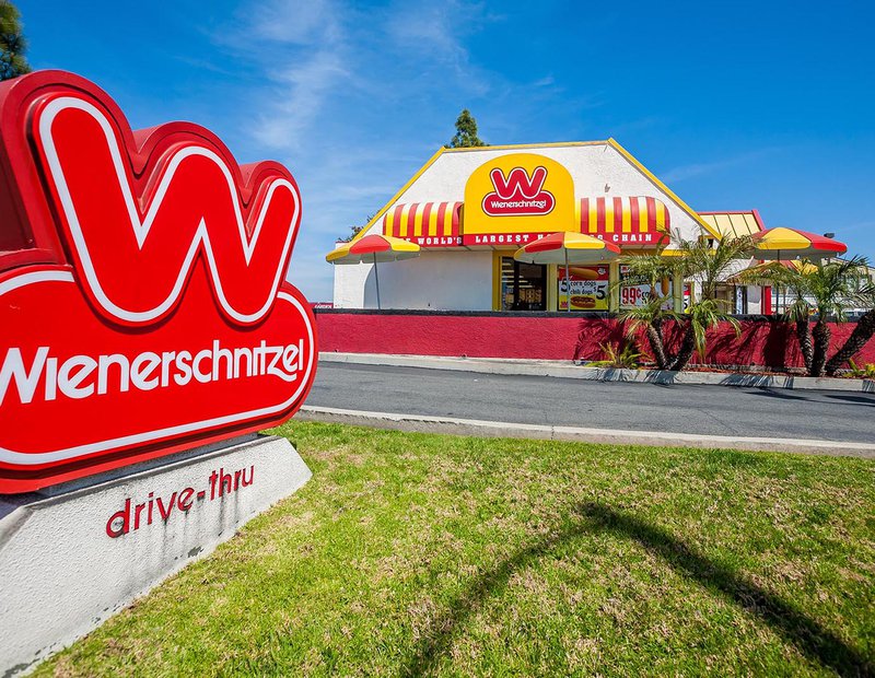 Exterior architectural image of a Wienerschnitzel restaurant in Costa Mesa, California