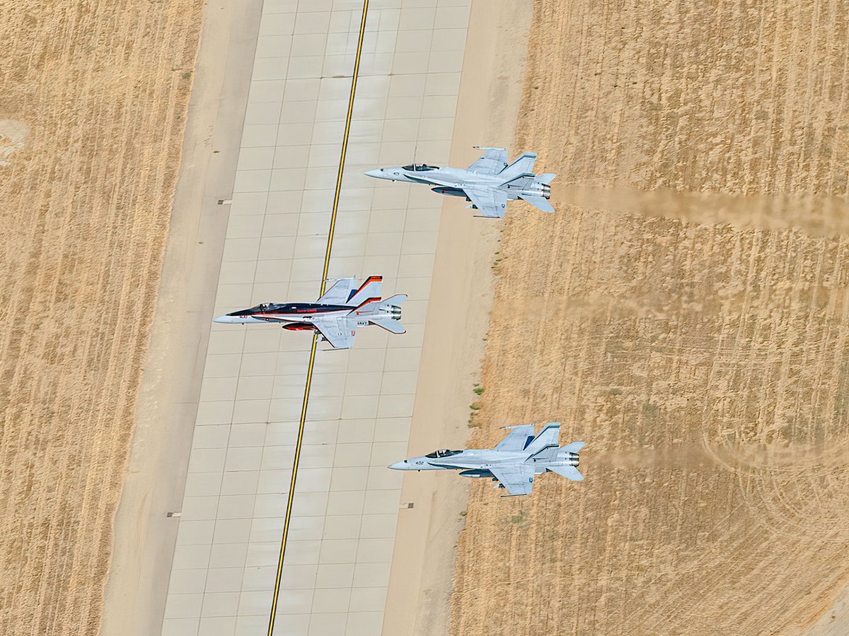 Aerial photo of three F-18 Hornets flying over Lemoore Naval Air Station during a Change of Command Ceremony