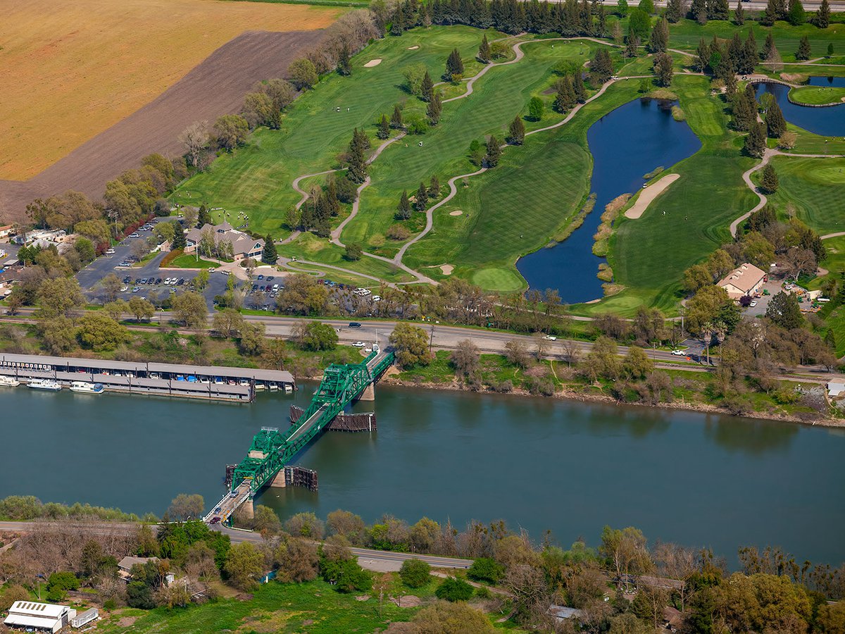 Aerial photo capturing the harmonious blend of residential, recreational, and aquatic elements that define this charming community south of Sacramento.