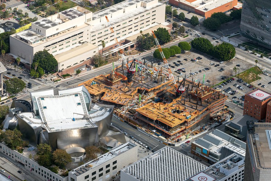 Blog aerial image of the framing phase of The Grand, with the Walt Disney Concert Hall in the foreground and the Stanley Mosk Courthouse in the background