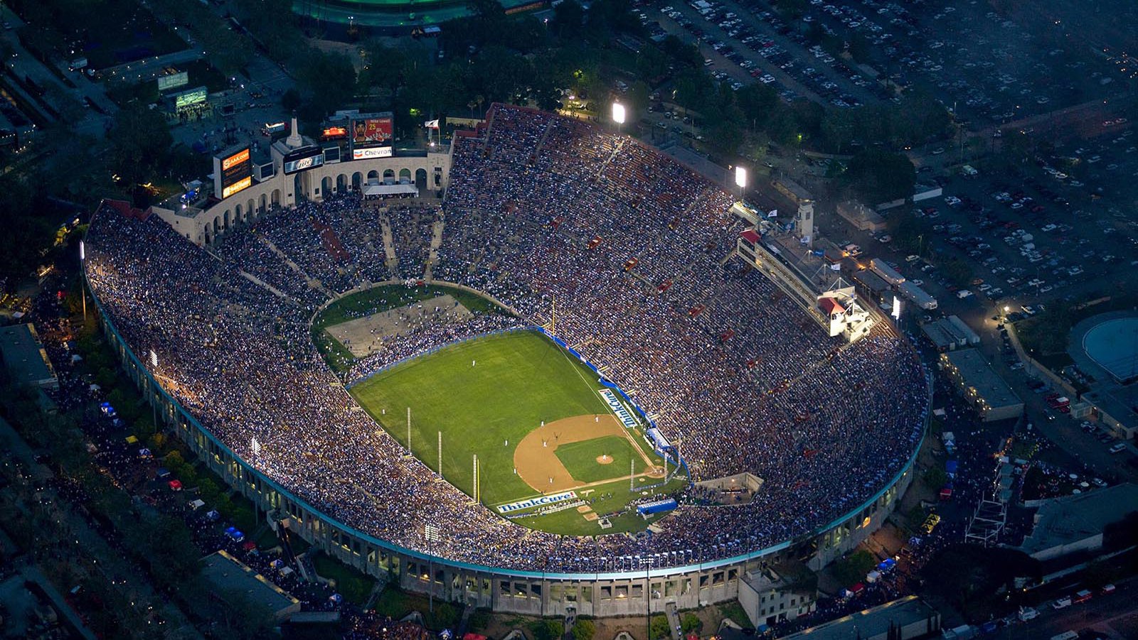 Sports photograph of the LA Memorial Coliseum during the 50th Anniversary baseball match between the Boston Red Sox and the Los Angeles Dodgers