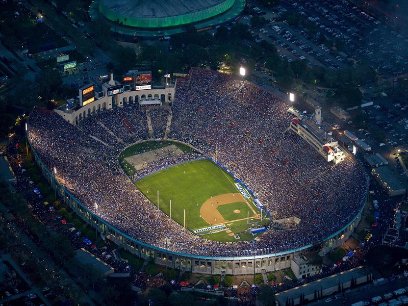 Sports photograph of the LA Memorial Coliseum during the 50th Anniversary baseball match between the Boston Red Sox and the Los Angeles Dodgers