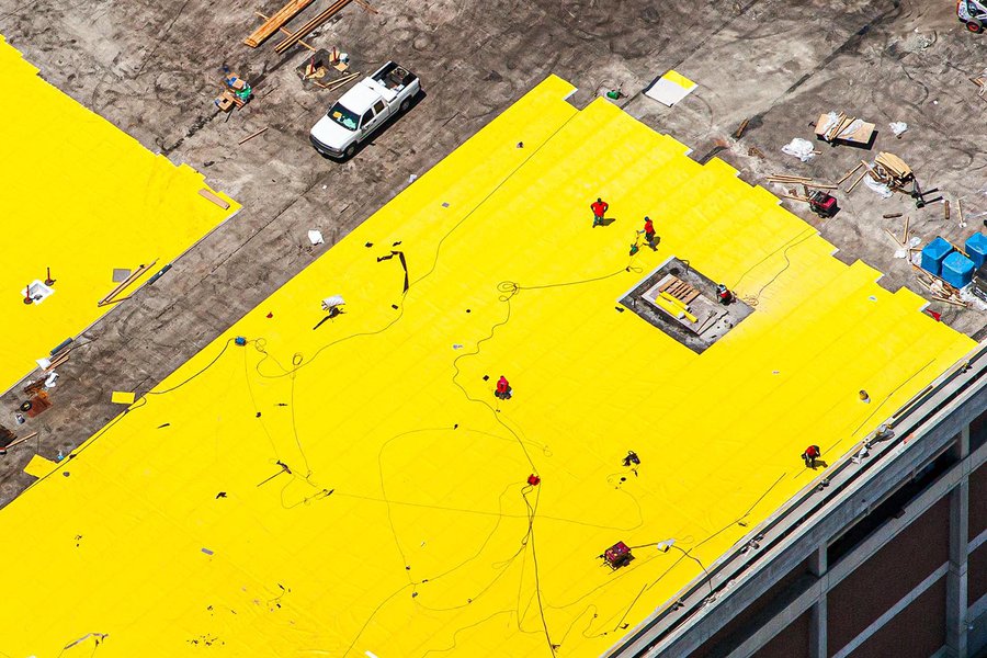 Construction photo of a roof waterproofing membrane installation in Los Angeles, California