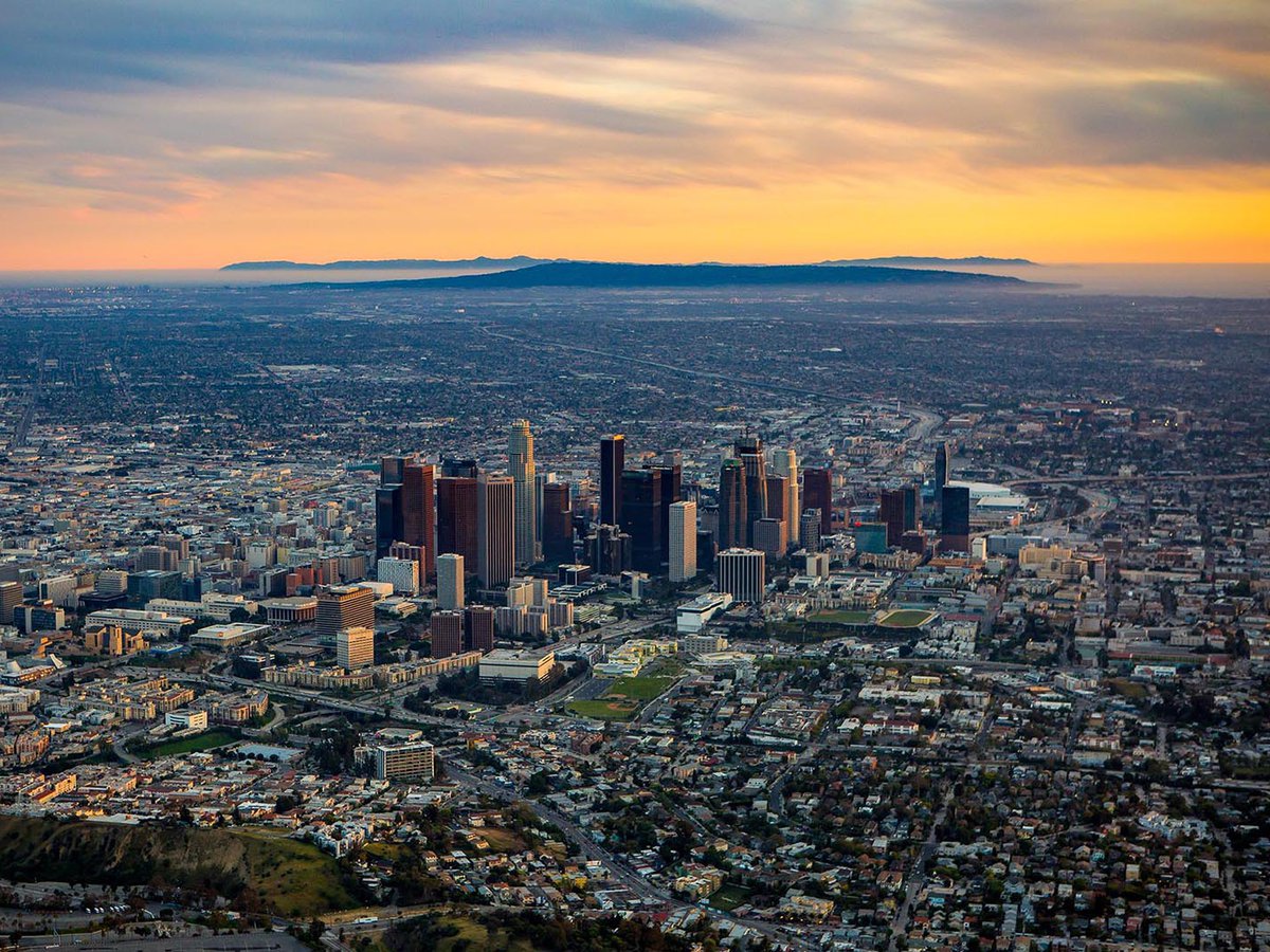 Aerial cityscape of Downtown Los Angeles Skyline at Sunset with Santa Catalina Island in the background