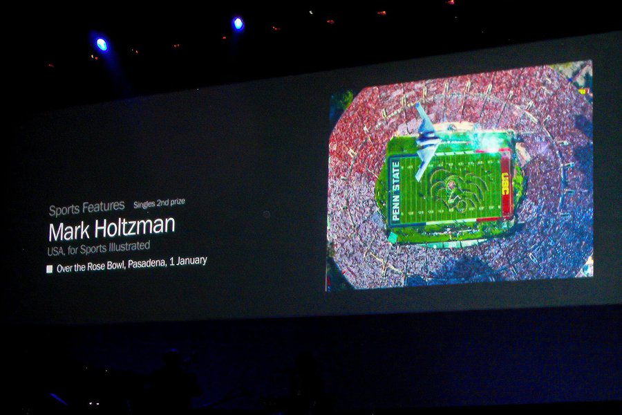 Press photo Mark Holtzman's award-winning photograph of the B-2 Bomber over the Rose Bowl at the 2010 Awards Ceremony in Amsterdam, Netherlands