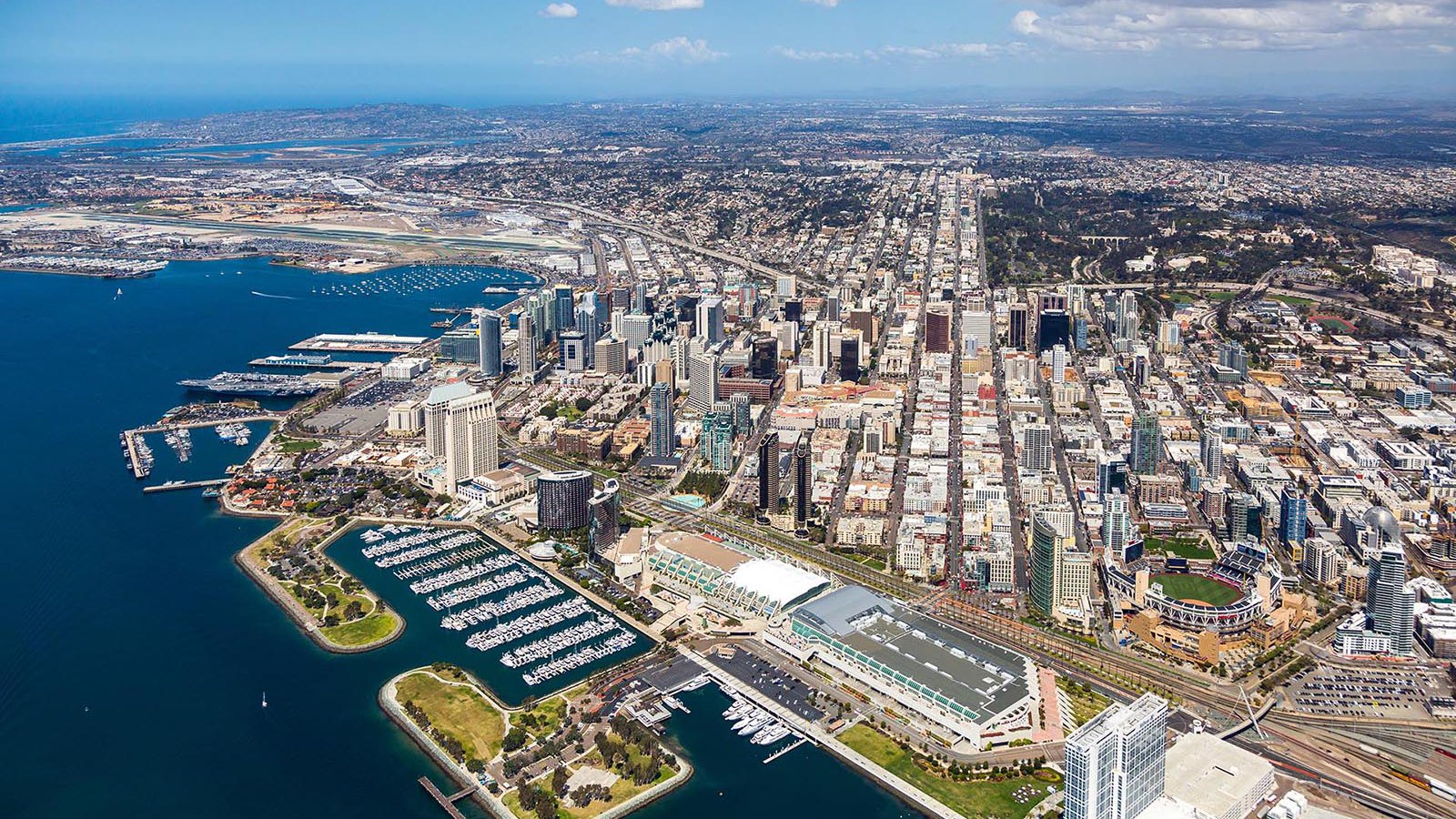 Aerial cityscape of the Downtown San Diego Skyline with the San Diego Convention Center and Petco Park in the foreground