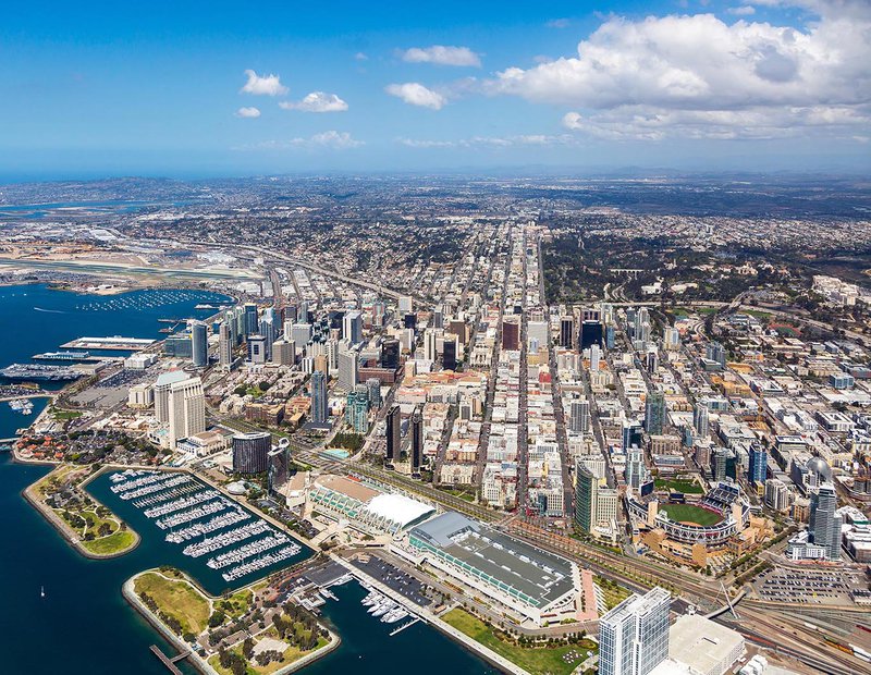 Aerial cityscape of the Downtown San Diego Skyline with the San Diego Convention Center and Petco Park in the foreground