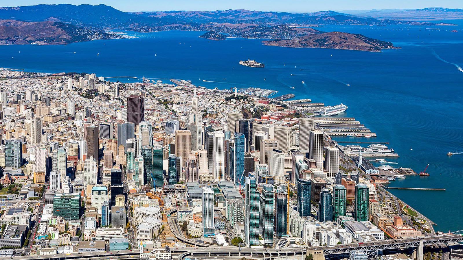 Aerial cityscape of Downtown San Francisco with Alcatraz Island in the background