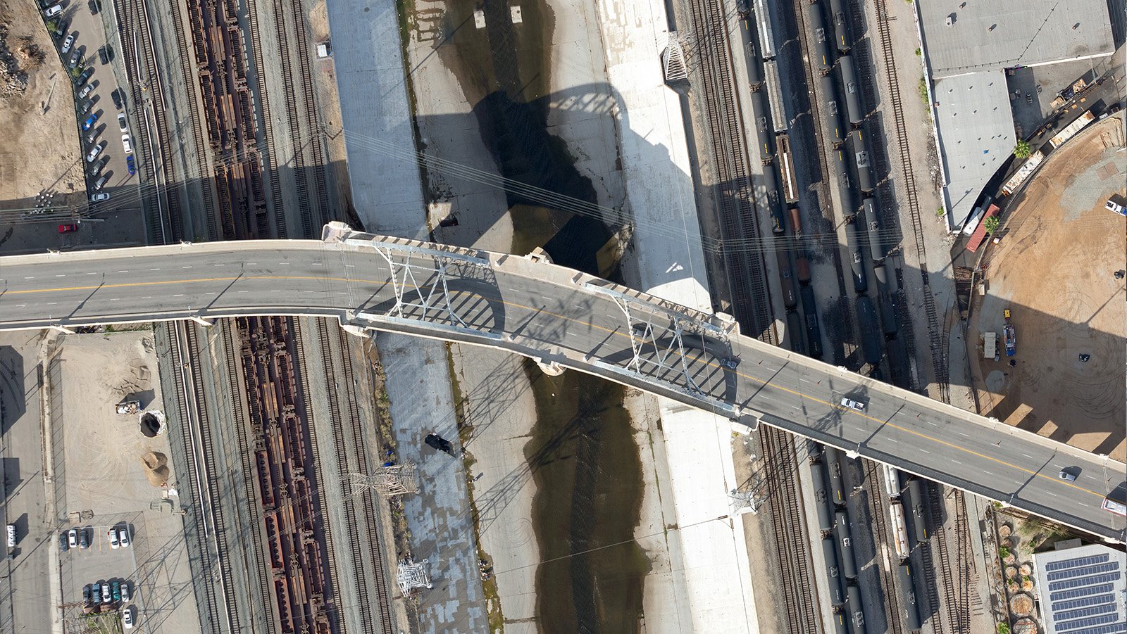 Vertical blog image of the original Sixth Street Bridge as it crosses the LA River, connecting DTLA and Boyle Heights, California