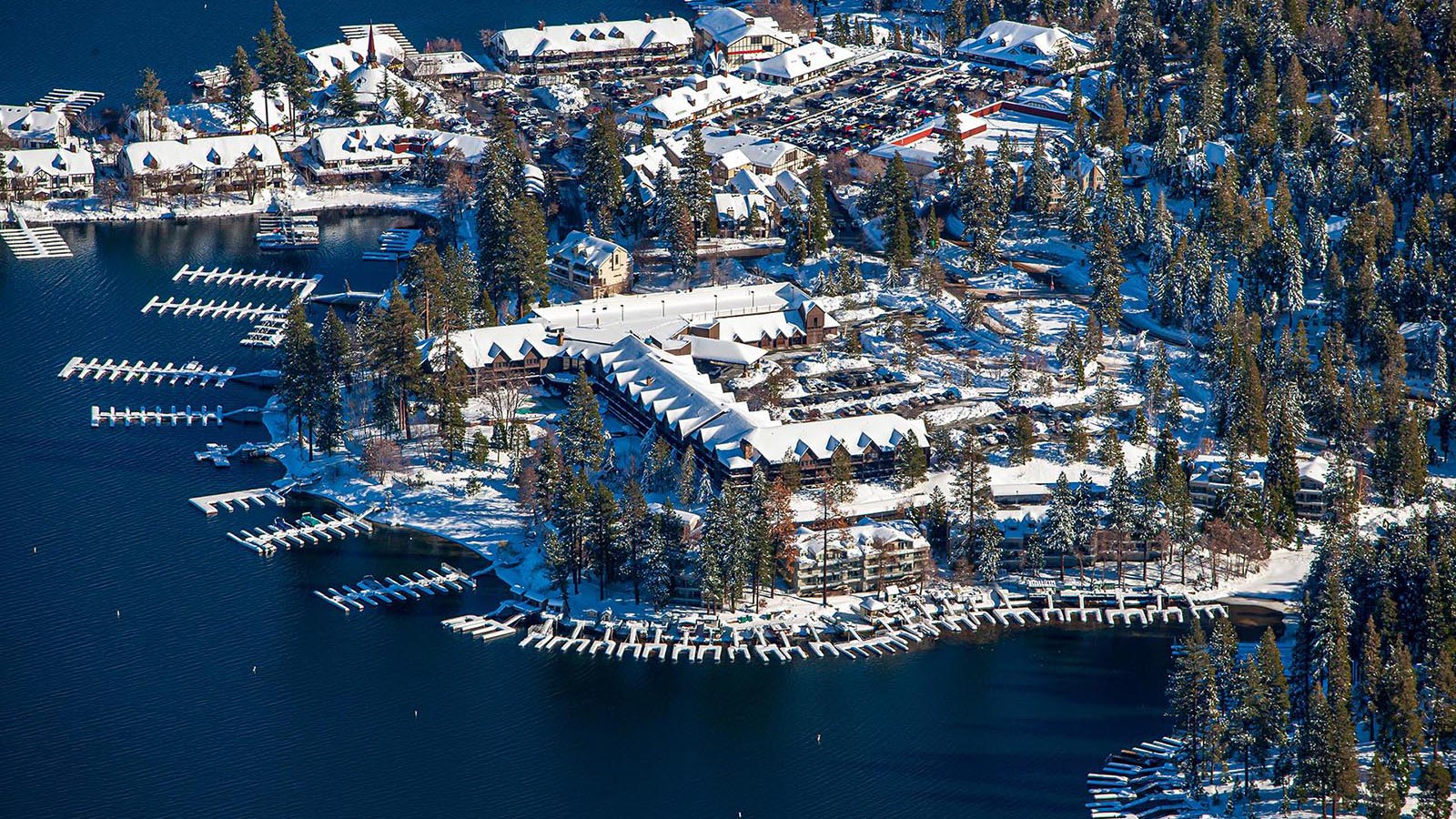 Commercial real estate image of the  Lake Arrowhead Resort & Spa covered in snow in the winter