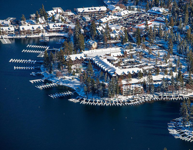 Commercial real estate image of the  Lake Arrowhead Resort & Spa covered in snow in the winter