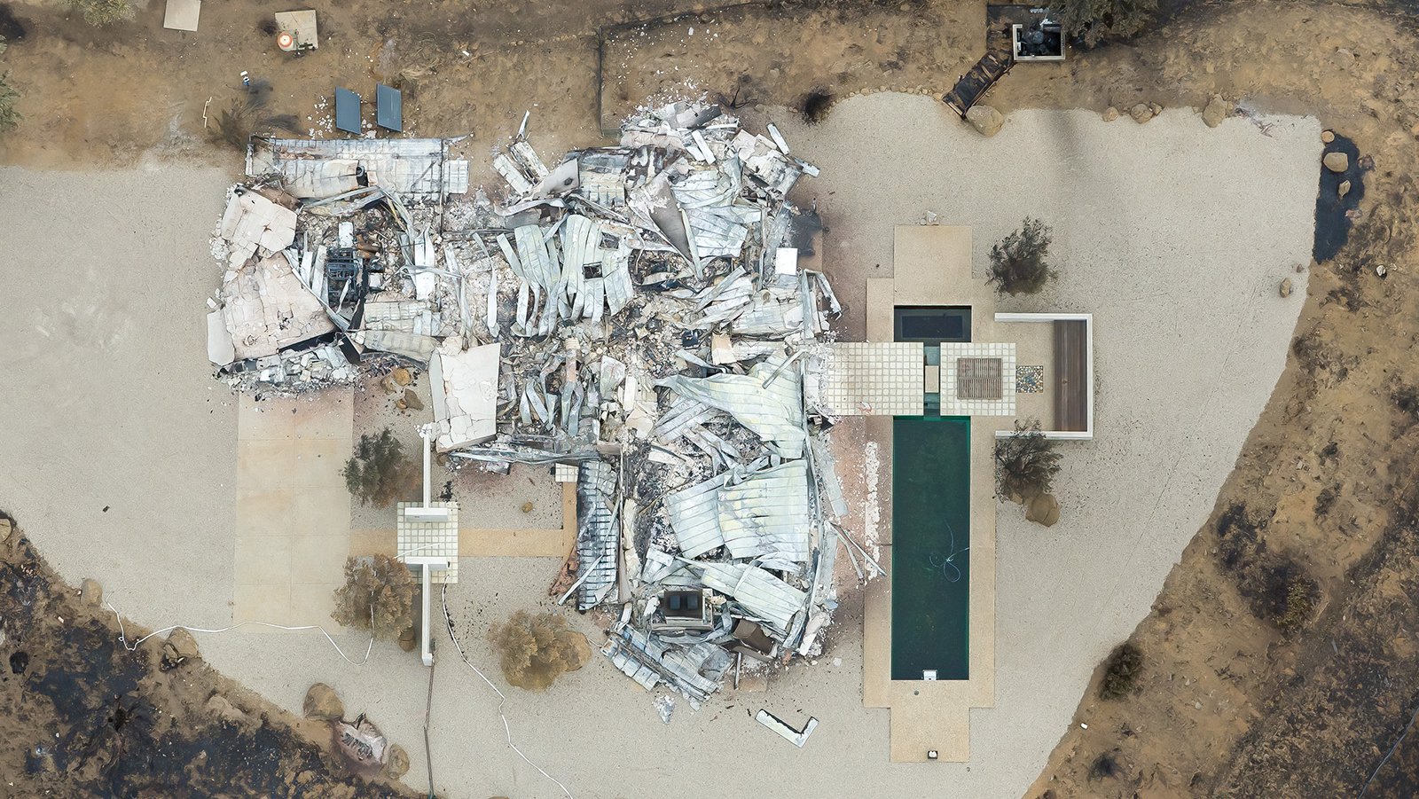 This aerial photograph shows the ruins of a home in Arroyo Sequit that was completely destroyed by the Woolsey Fire in November 2018.