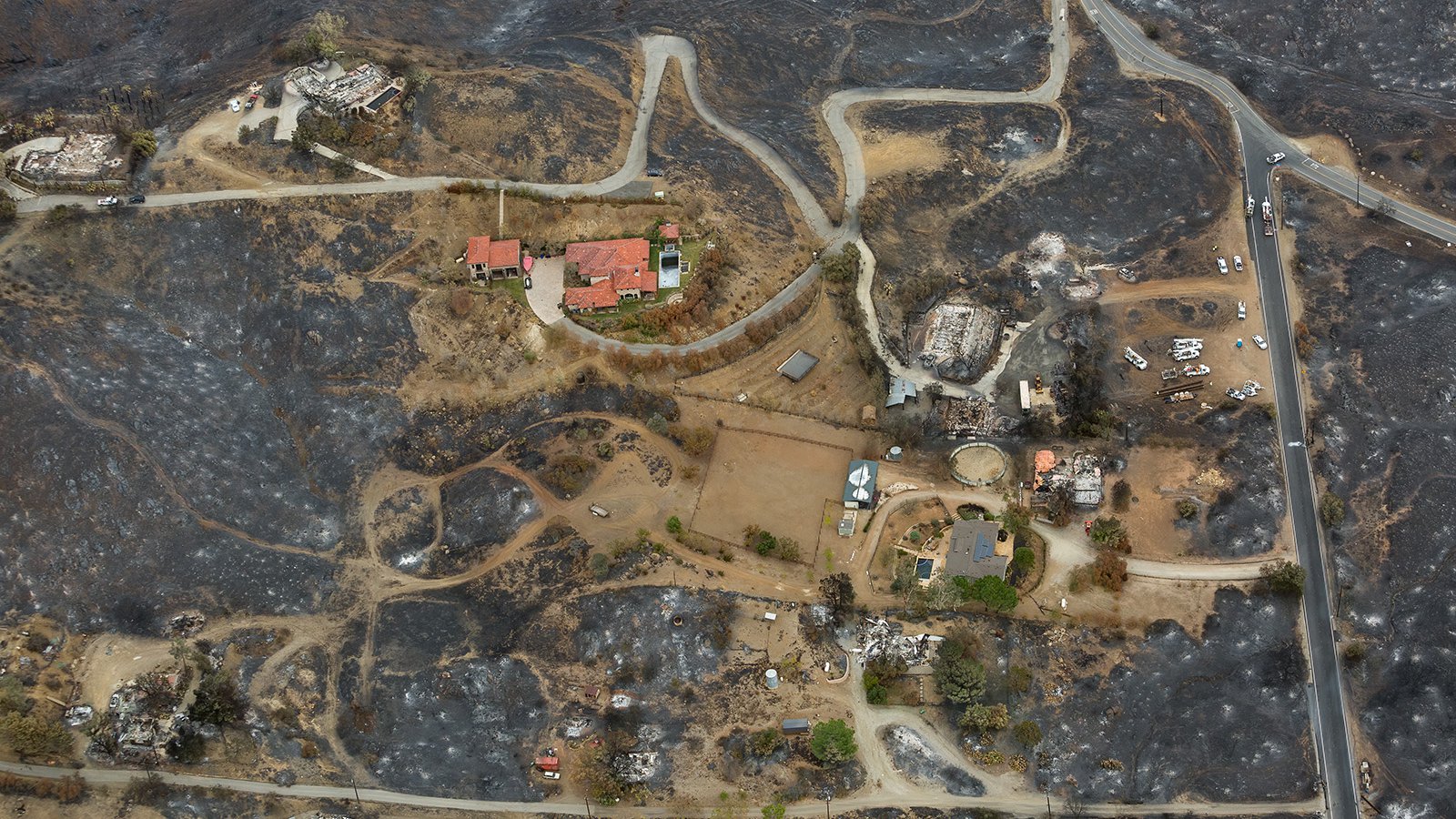 This aerial photograph captures a clear image of the aftermath of the Woolsey Fire in Arroyo Sequit. Aerial photography providedes an unparalleled view of the destruction caused by the fire, allowing us to see its full impact on this community and beyond.