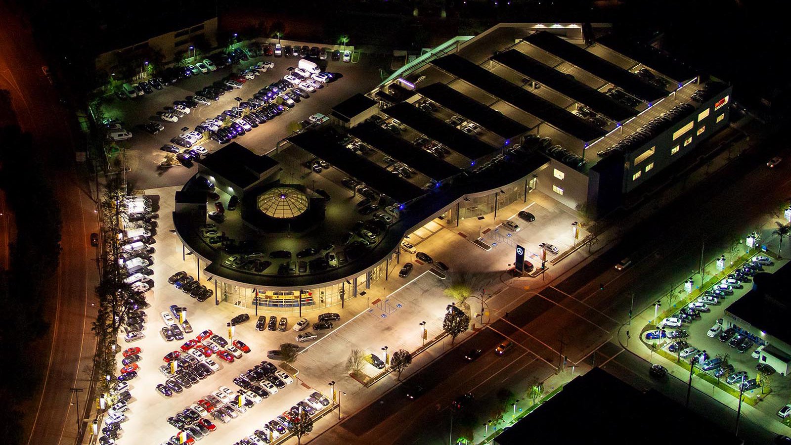 Commercial real estate photo of a Mercedes-Benz Dealership at night in Van Nuys, California