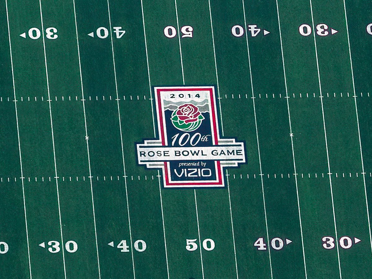 Close-up blog photo of the 100th Rose Bowl Logo in the middle of the field at the Rose Bowl Stadium before the game starts