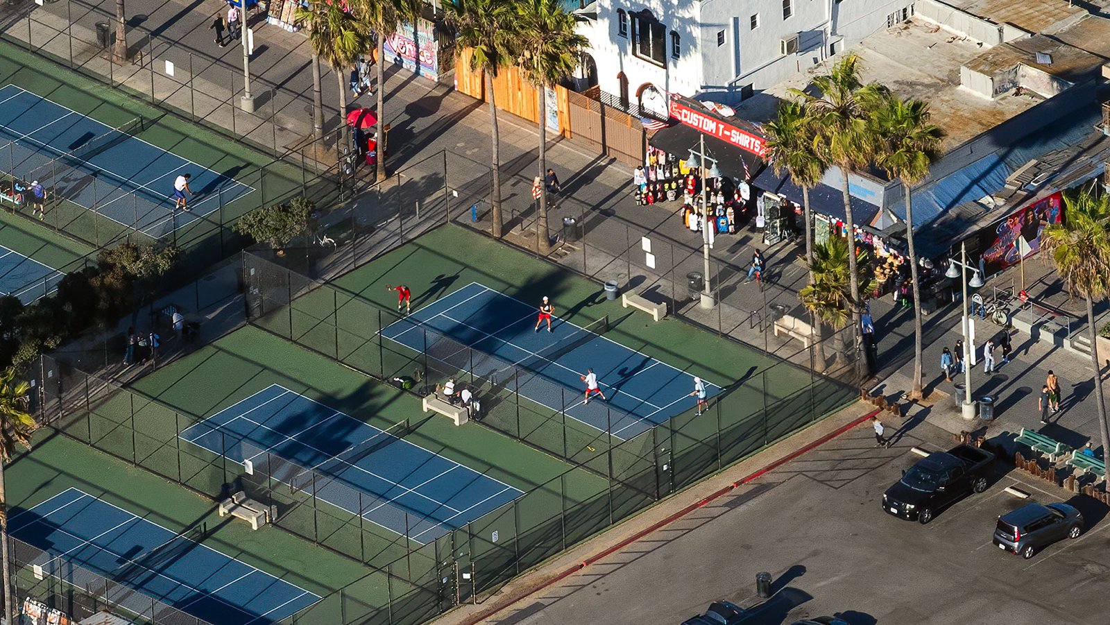 Blog photograph of paddle tennis players during a match at the paddle tennis courts in Venice Beach, California on Christmas Day, 2020.