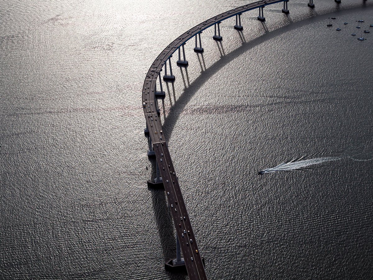 Blog photo of the suns reflection on the waves under Coronado Bridge in San Diego, California