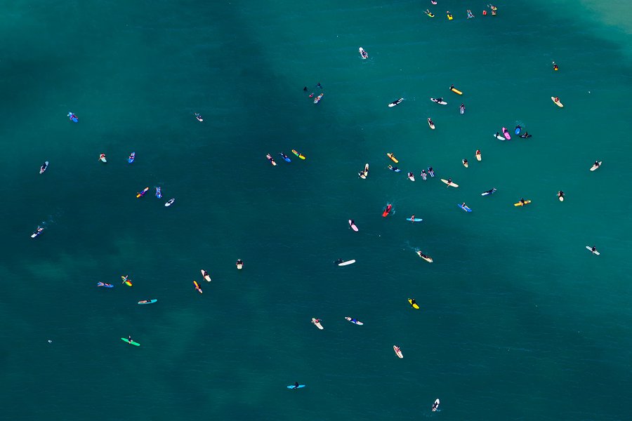 Close-up blog photo of surfers in Dana Point, California enjoying the warm summer weather