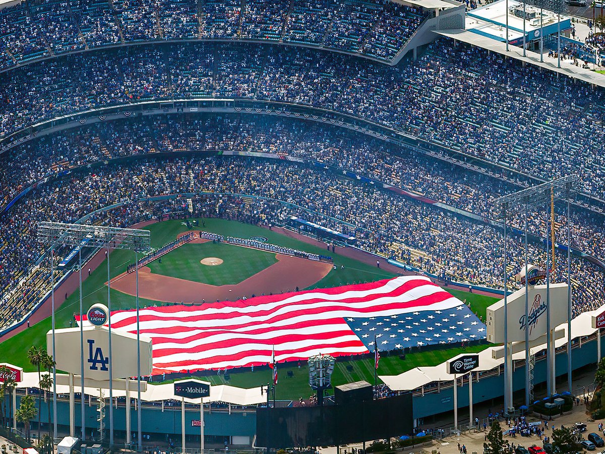 Blog photo of a giant American flag on the field on Open Day of the 2013 baseball season at a game between the Los Angeles Dodgers and San Francisco Giants at Dodger Stadium in Los Angeles, California