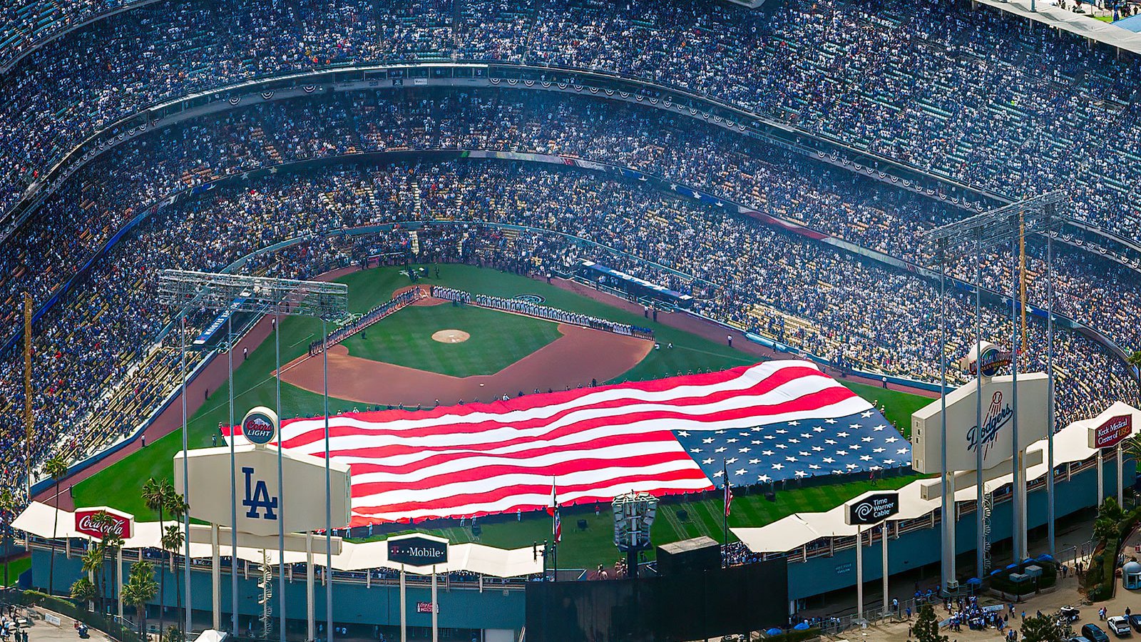 Blog photo of a giant American flag on the field on Open Day of the 2013 baseball season at a game between the Los Angeles Dodgers and San Francisco Giants at Dodger Stadium in Los Angeles, California