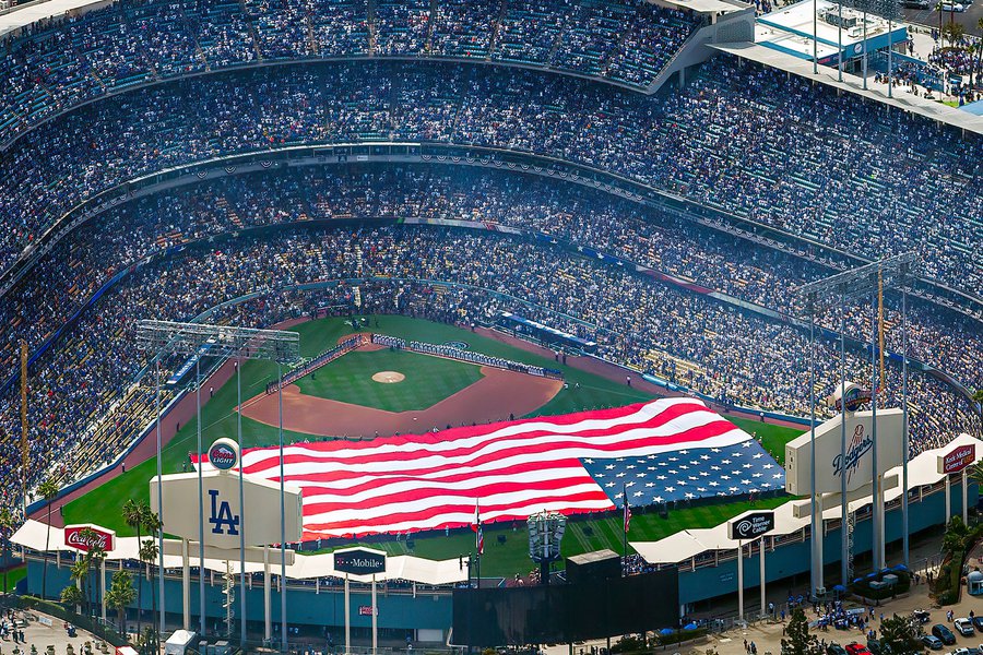 Blog photo of a giant American flag on the field on Open Day of the 2013 baseball season at a game between the Los Angeles Dodgers and San Francisco Giants at Dodger Stadium in Los Angeles, California