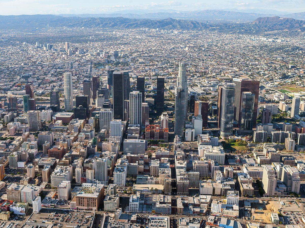 Aerial blog photo of Downtown Los Angeles looking westbound with the Hollywood Sign in the background