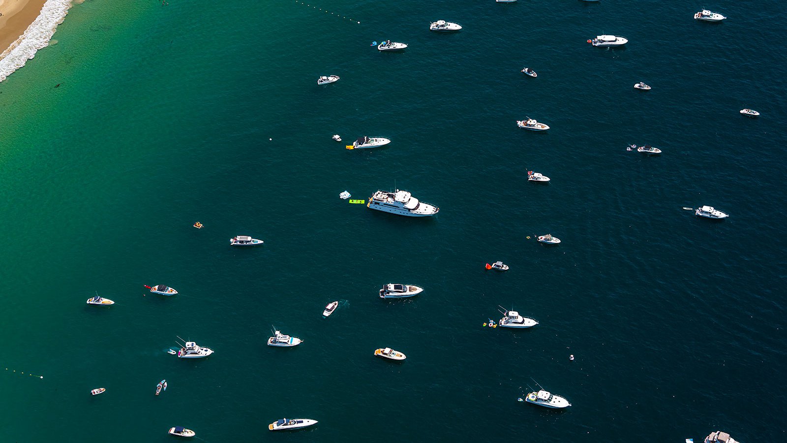 Blog image of ships, yachts and megayachts anchored in Emerald Bay in Laguna Beach, California