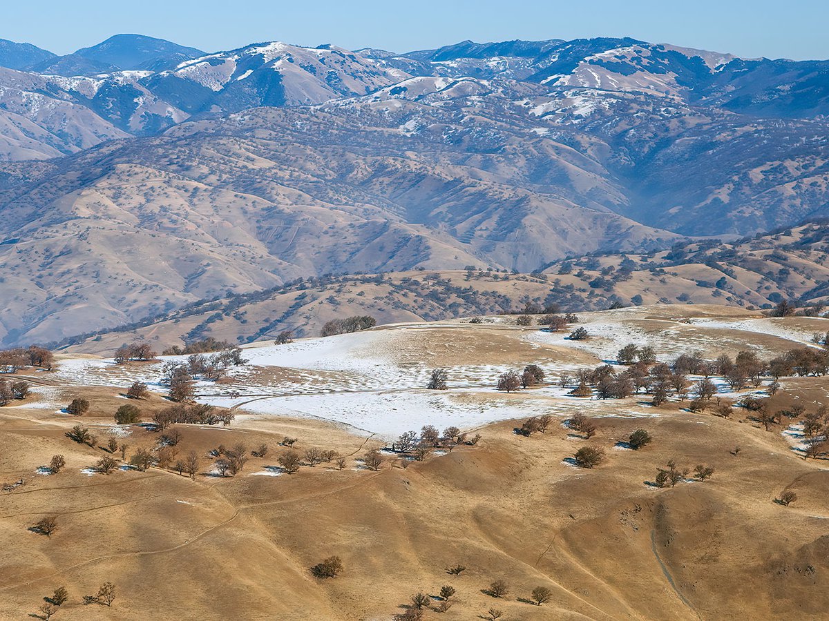 Aerial photo of the first snow of the season, dusting the Grapevine mountains about 60 miles north of Los Angeles, California