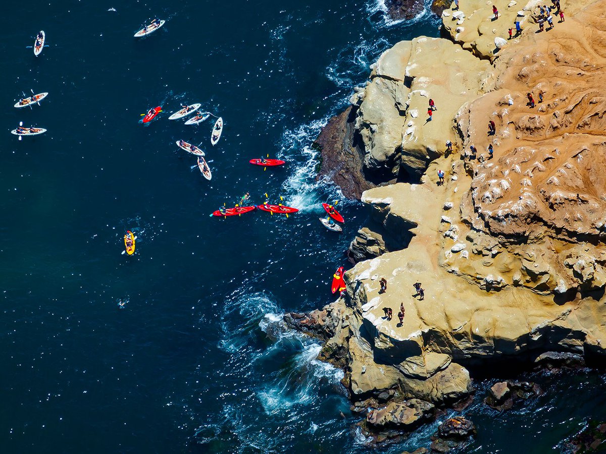 Zoomed blog image of kayakers at the La Jolla Bay Caves, just north of San Diego, California