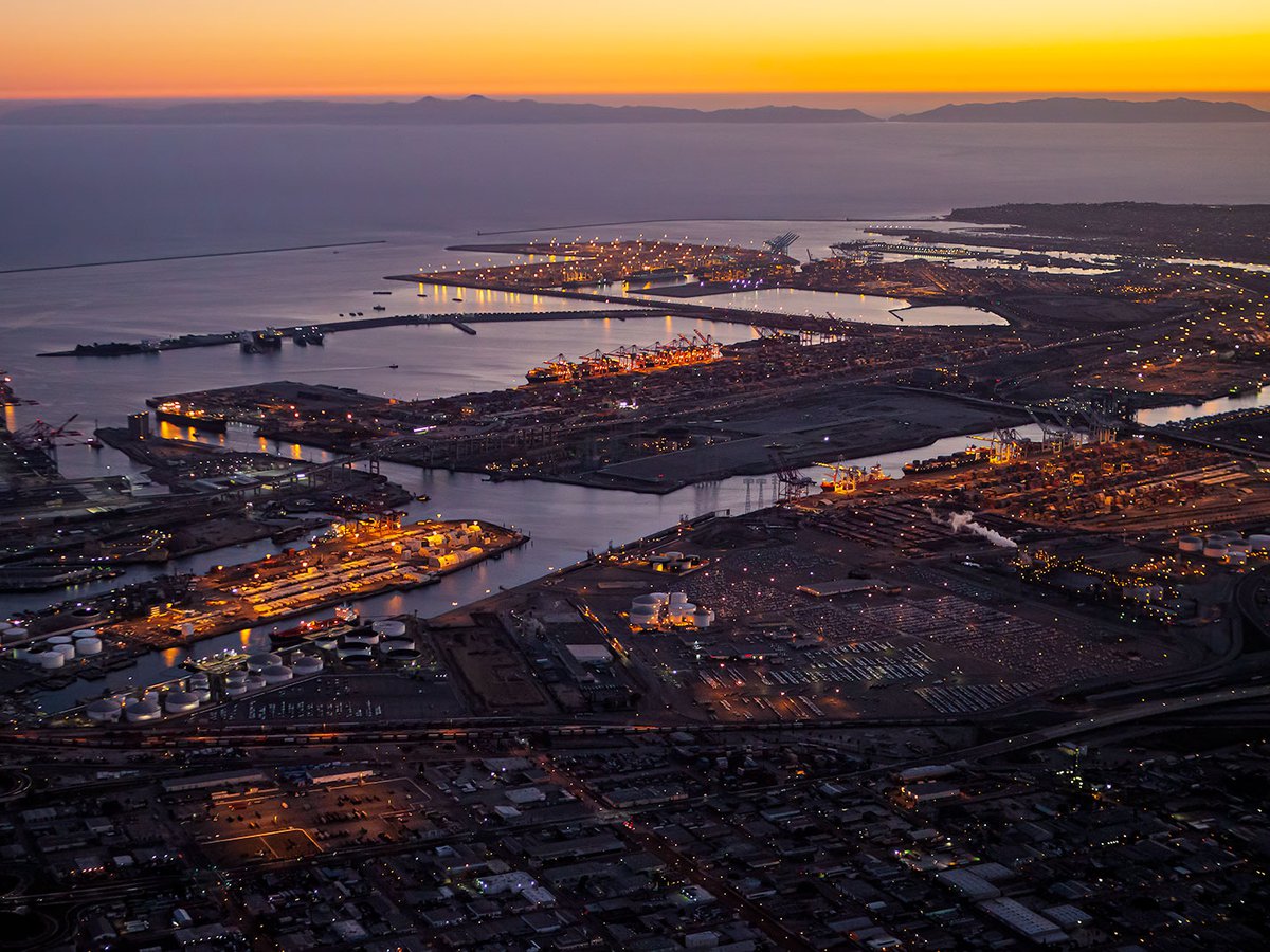 Blog photo of the Ports of Los Angeles and Ports of Long Beach filled with shipping containers at sunset